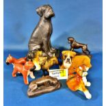 A collection of boxer dog figurines in china and resin, various sizes