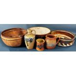A collection of Portuguese and other stoneware bowls with floral detail