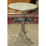 A small novelty cast metal occasional table with circular top raised on simulated entwined stags