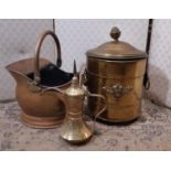 A Turkish brass coffee pot of traditional form, a copper coal helmet and a further brass coal