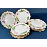 19th century dessert plates probably Worcester with hand painted floral and ribboned garland borders