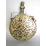 A 19th century brass engraved circular powder flask, 14cm diam x 20cm high.