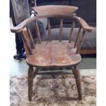 A Windsor smokers bow elbow chair, with elm seat
