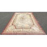 A large Aubusson style tapestry wall hanging with a central floral medallion and floral borders,