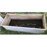 A rectangular galvanised steel field water trough with rolled rim, 127cm long x 50cm wide x 42cm