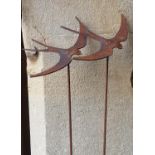 An ironwork border stake in the form of two flying swallows