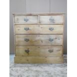 A pine chest of three long and two short drawers on a plinth base with stripped finish