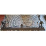 An art nouveau brass fire curb embellished with enamel panels, 143cm wide x 36cm deep