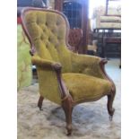 A Victorian mahogany drawing room chair with partial show wood frame, buttoned back finish on