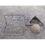 An old iron work stable manger, a further vintage wall mounted cast iron corner stable trough, one