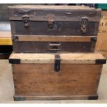 A 19th century pine and steel banded trunk and one other travelling trunk