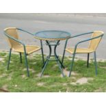 A decorative three piece bistro set with tubular frame