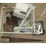 A steel basket containing a quantity of unused galvanised door fittings, hinges, latches, etc