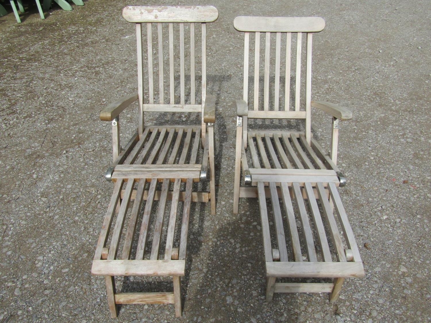A pair of weathered contemporary teak folding steamer type garden lounge chairs with slatted - Image 2 of 3