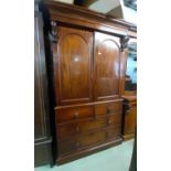 A Victorian mahogany linen press enclosed by two long and two short drawers, the upper section by