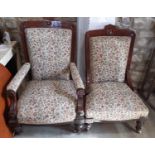 A graduated pair of Victorian mahogany drawing room chairs with carved and moulded frames,