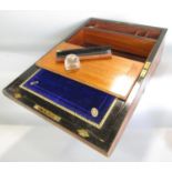 A 19th century walnut writing slope with a good fitted interior and a blue velvet and tooled gold