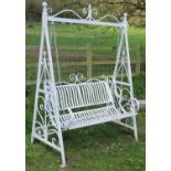 A painted metal two seat garden swing raised on A framed supports with open scroll detail, 154 cm (
