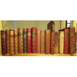 A collection of 19th century and early 20th century leather bound volumes including Dickens Martin