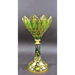 A Bohemian green and gold decorated raised bowl with crenellated Gothic rim on a spread foot, 27cm