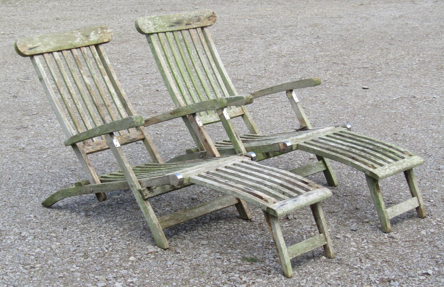 A pair of weathered teak folding steamer type garden lounge chairs with slatted seats, backs and - Image 2 of 3