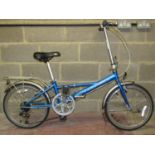 A Ridgeback Impulse folding bicycle in metallic blue colourway