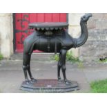 19th century Anglo Indian carved camel table, with shaped tray top, on a fully carved base, 73cm