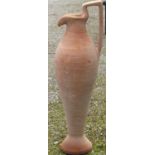 A large floor standing Mediterranean terracotta ewer, 106cm high