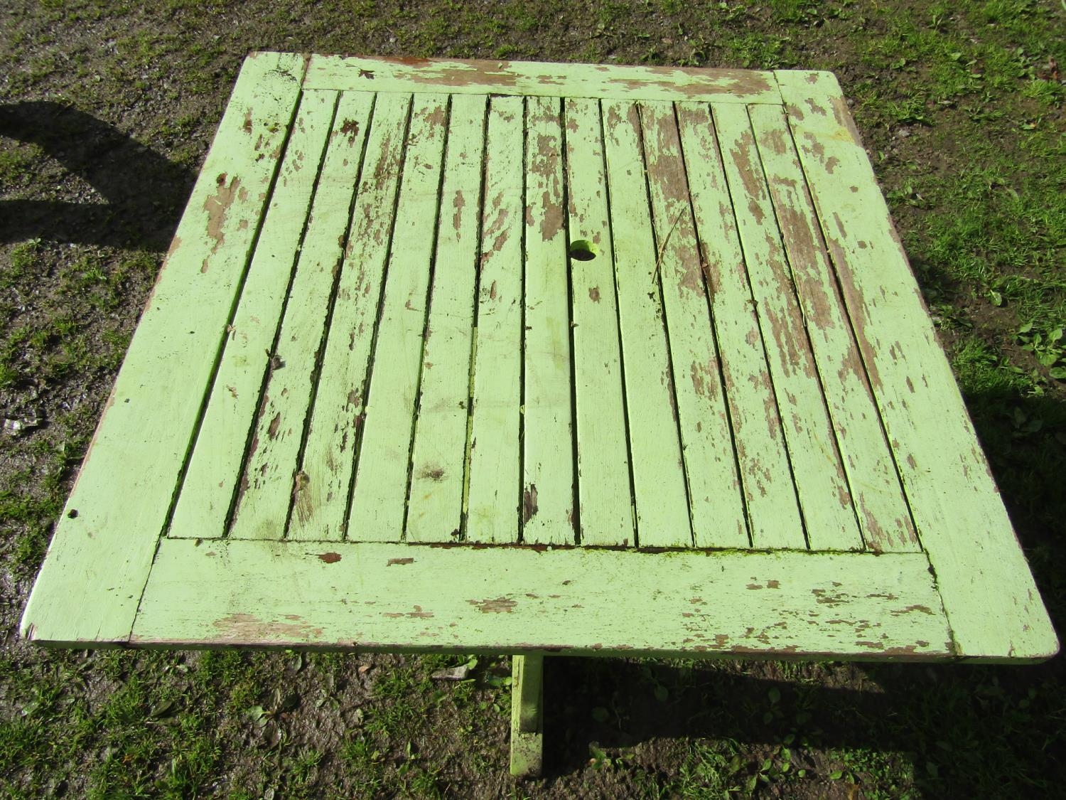 An Arts & Crafts style light green painted and weathered teak garden table, the square slatted - Image 2 of 2