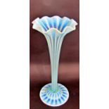 A Charles Kempton pale blue green ribbed trumpet Art Glass tall vase, on a spread base, 48cm tall.