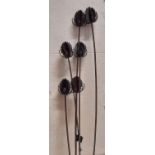 Iron work garden border stake in the form of teasels with six stems