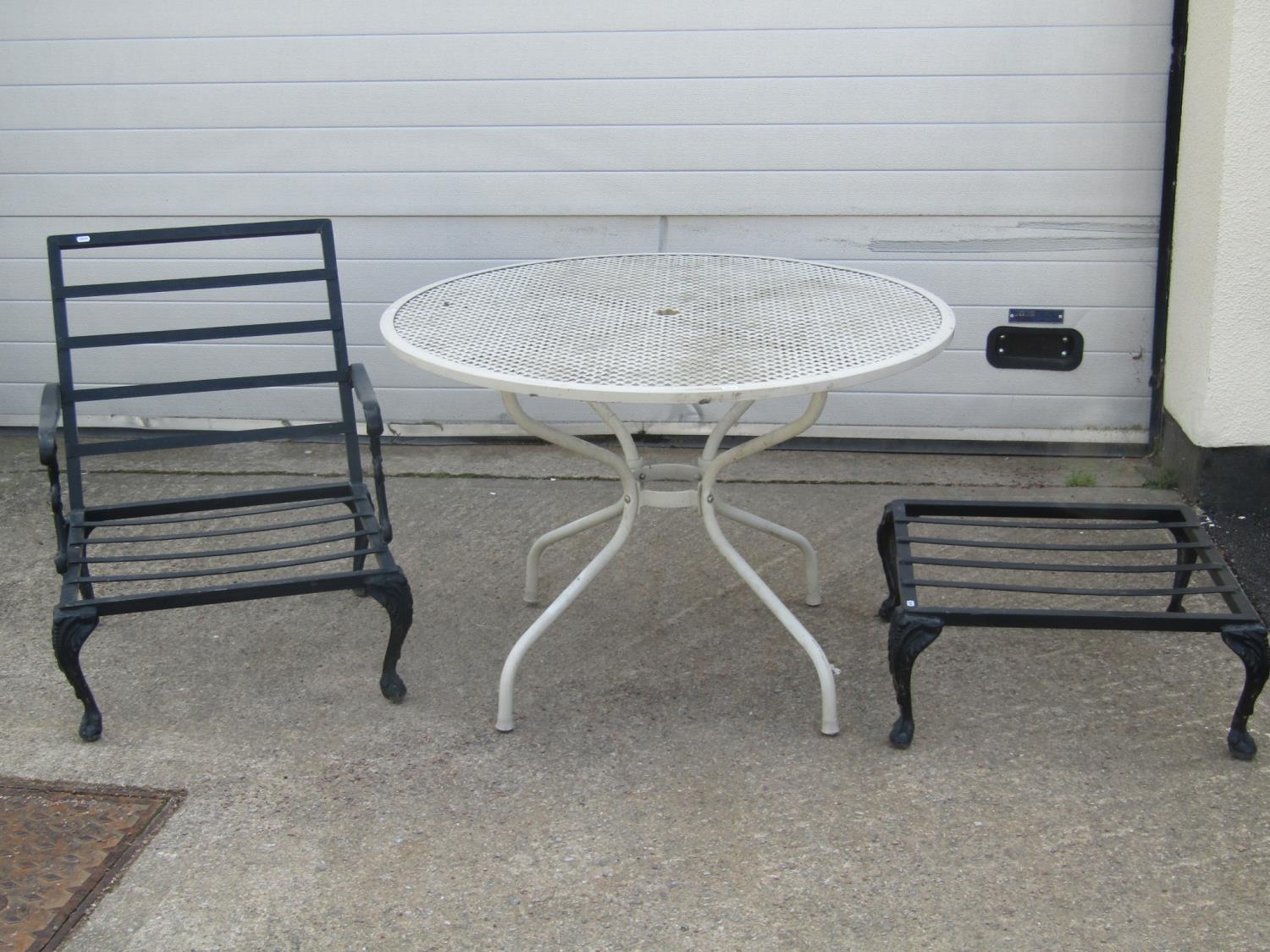 A painted cast alloy circular garden terrace table with lattice top 105 cm diameter, together with a