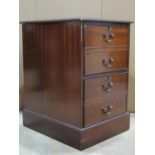 A mahogany filing cabinet in the Georgian style, with inset leather panelled top over two deep