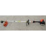 A Tanaka lightweight petrol driven garden strimmer TBC-2390 series