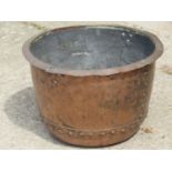 An antique copper with flared rim and pop riveted seams 47 cm diameter x 30 cm high (af)