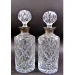 A pair of silver collared cut glass decanters, Birmingham 1978 maker J B Chatterly & Sons Ltd,