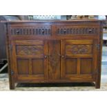 Good quality reproduction old English style oak dresser base enclosed by a pair of panelled doors