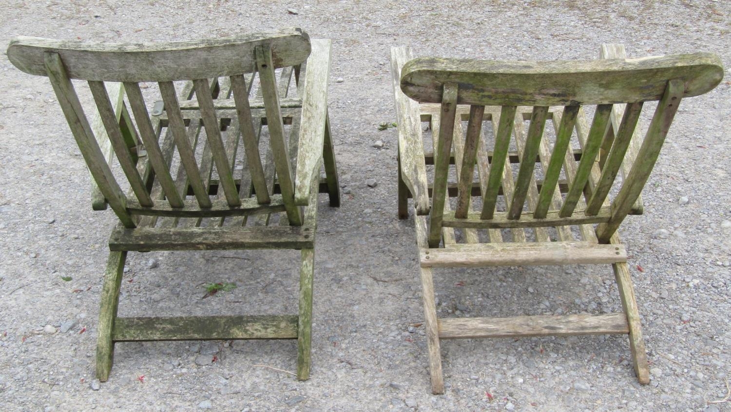 A pair of weathered teak folding garden steamer type lounge chairs with slatted seat, back and - Image 3 of 4