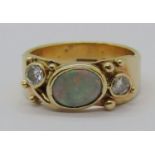 Stylised 9ct opal and diamond ring, each diamond 0.15ct approx, maker 'EJC', size P, 5.9g