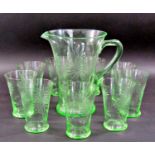 A mid 20th century iridescent green lemonade set, one jug and nine glasses decorated with etched