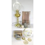 A miscellaneous collection of items including, a brass oil lamp, a wooden linen fold panel, two