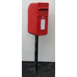 An Elizabeth II cast alloy post box and associated stand, stamped Carron Company Stirlingshire
