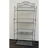 A heavy gauge freestanding folding steel rack with four partially graduated strapwork tiers, 83 cm