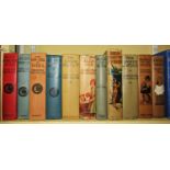 A collection of Edwardian period children's books with decorative bindings to include works by