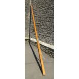 A stained pine mast/flag pole, 4 metres long