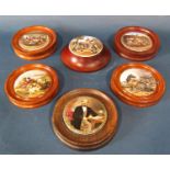 A collection of Pratt ware ceramic pot lids, each depicting a different scene, some with