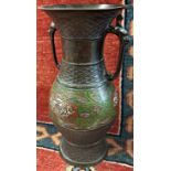 A Chinese two handled baluster shaped vase with lattice and floral enamel detail 23cm high