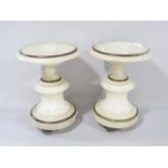 A pair of white marble shallow urns on a waisted and fluted base with brass string and feet, 22cm