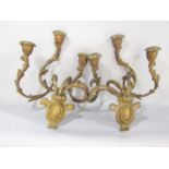 A pair of 19th century gilt gesso and iron constructed wall candle sconces, in a distressed state
