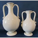 Two creamware crackle glazed large vases with drawn necks, decorated in relief with scrolling